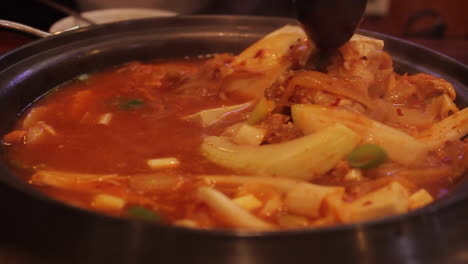 kimchi boiling and bubbling in pot in seoul south korea