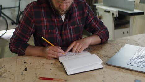 Craftsman Designing in a Workshop