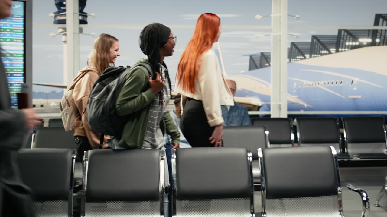 Chatting, runway control tower and multiethnic group of friends in airport