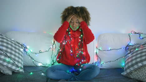 Tired-woman-trying-to-untangle-garland