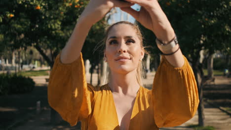 stylish young woman taking pictures outdoor.