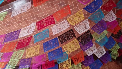 Slow-revealing-shot-of-Mexican-Fiesta-Papel-Picado-Garland-hanging