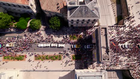 aerial overhead of montpellier pride parade, colorful streets