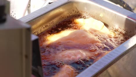 Cooking-argentinian-empanadas,-golden-and-delicious-frying