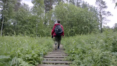 man hiking in a forest