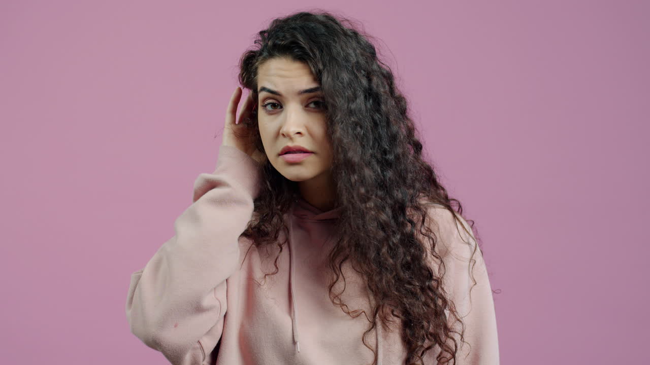 Woman with Curly Hair in a Hoodie