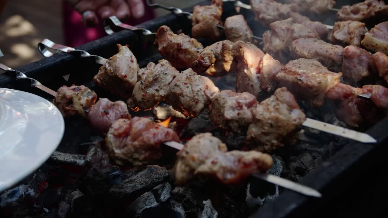 Shashlik, meat on a BBQ with fire cooking