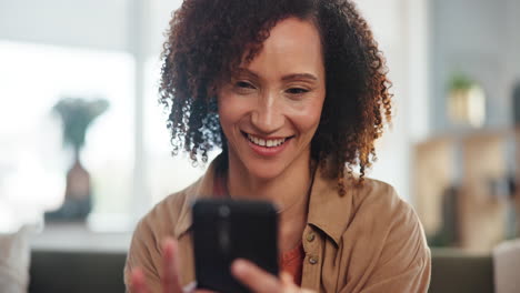 woman laughing at phone