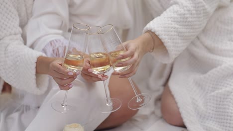 three friends toasting with champagne glasses