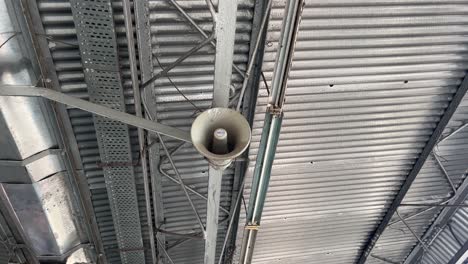 the railway station's microphone and announcements are being made.