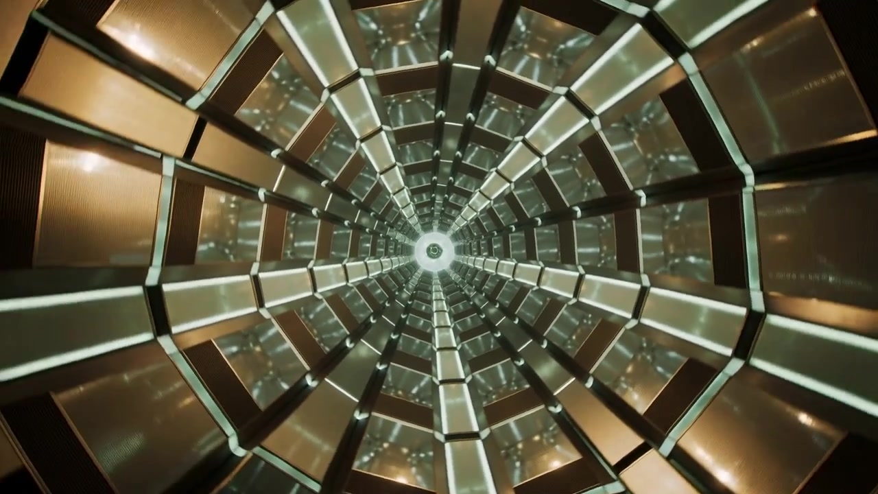 Pannelli rotanti del tunnel, nervature che si muovono nel condotto, luce centrale che brilla, creando movimento.