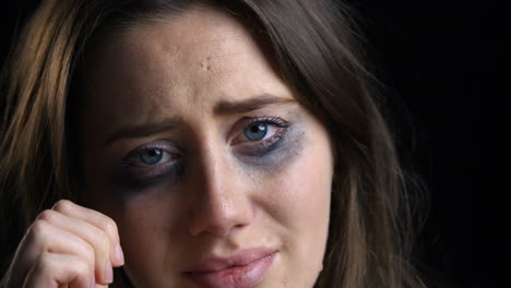 Studio-Portrait-Shot-Of-Unhappy-Woman-With-Smudged-Make-Up