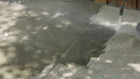 man-pressure-washing-sidewalk