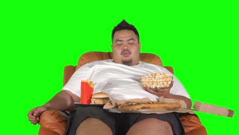 man looks bored eating snack and junk foods