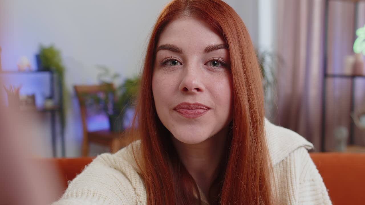 Pov young woman girl making online selfie video call talking waving hand hello looking at camera