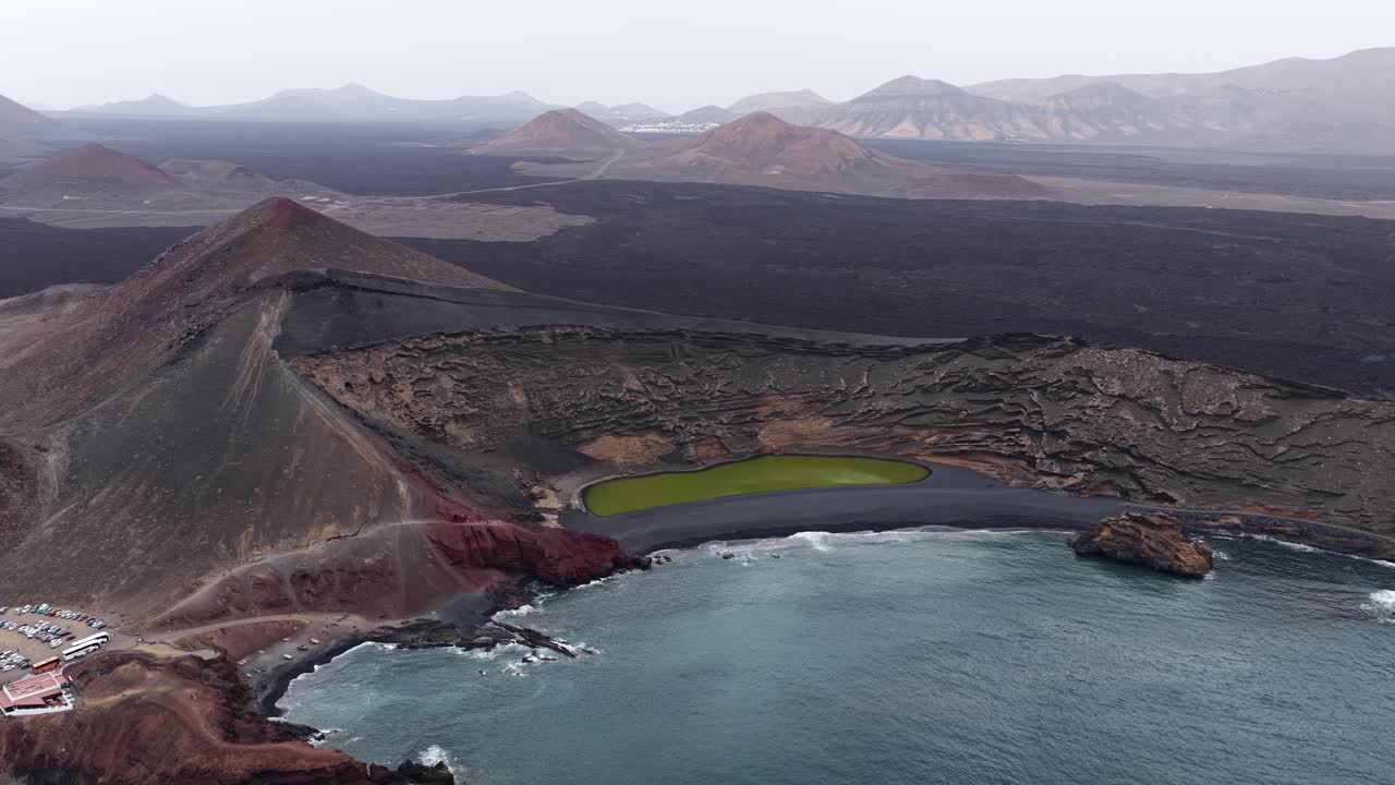 El Golfo's green lagoon and black sand beach in Lanzarote's volcanic landscape