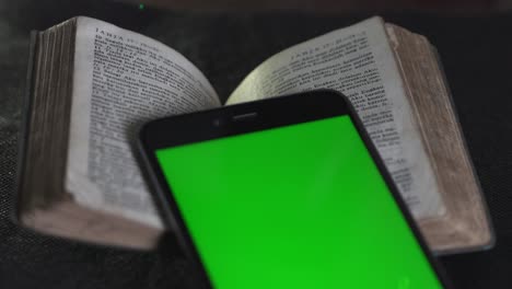 pocket old bible and smartphone