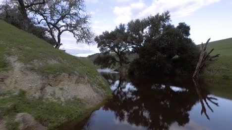 drone flies above temporary lake that the rain has recently formed