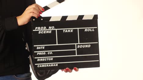 woman holding a clapperboard