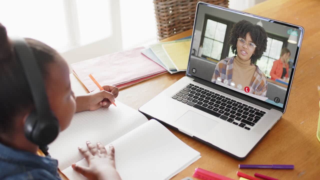 African American students engage in online learning together.