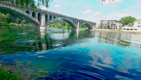 Look-at-the-Pont-du-Chemin-de-Fer,-railway-bridge-at-Huy-on-a-sunny-summer-day,-above-The-Maas-in-Huy,-Belgium,-4k,-50fps