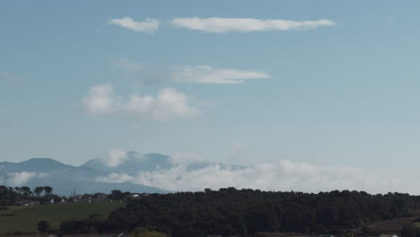 timelapse of the movement of the clouds above the famous catalan mountain with the morning lights- montseny