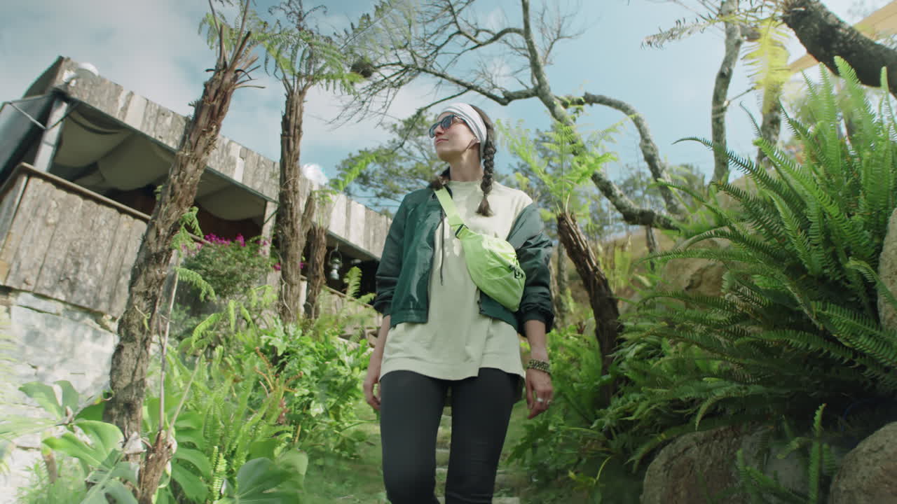 Female Tourist Walking Down at Glampsite and Observing Nature