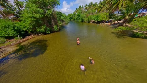 flying over tourists swimming at rio arroyo salado in cabrera, dominican republic