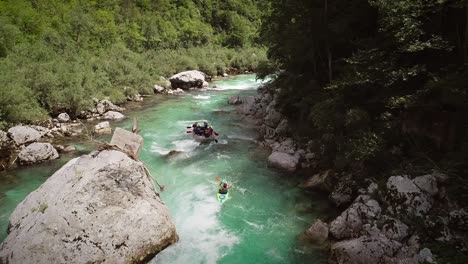 aerial view of kayaker paddling in whitewater at soca river, slovenia.