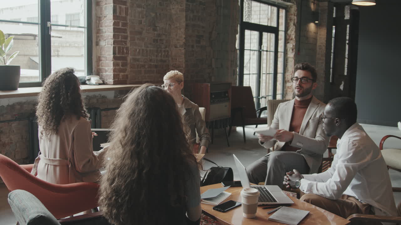 Business Couple Arriving at Informal Business Meeting with Partners