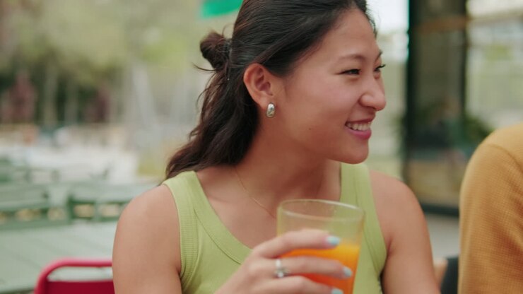 Lunch communication. International friends eating, talking and laughing. Focus