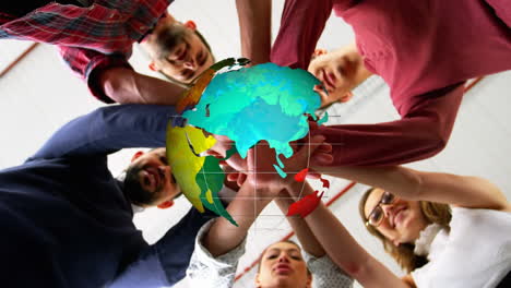 animation of globe over work colleagues stacking hands in background