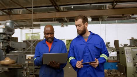 two metalsmiths discussing over laptop 4k