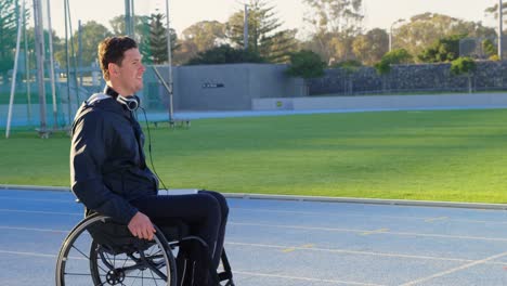 disabled athletic moving with wheelchair at sports venue 4k