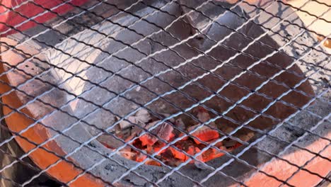 rice cracker grilling over open charcoal flame