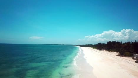 long white sandy beach on the coast province of kenya in africa. aerial drone shot