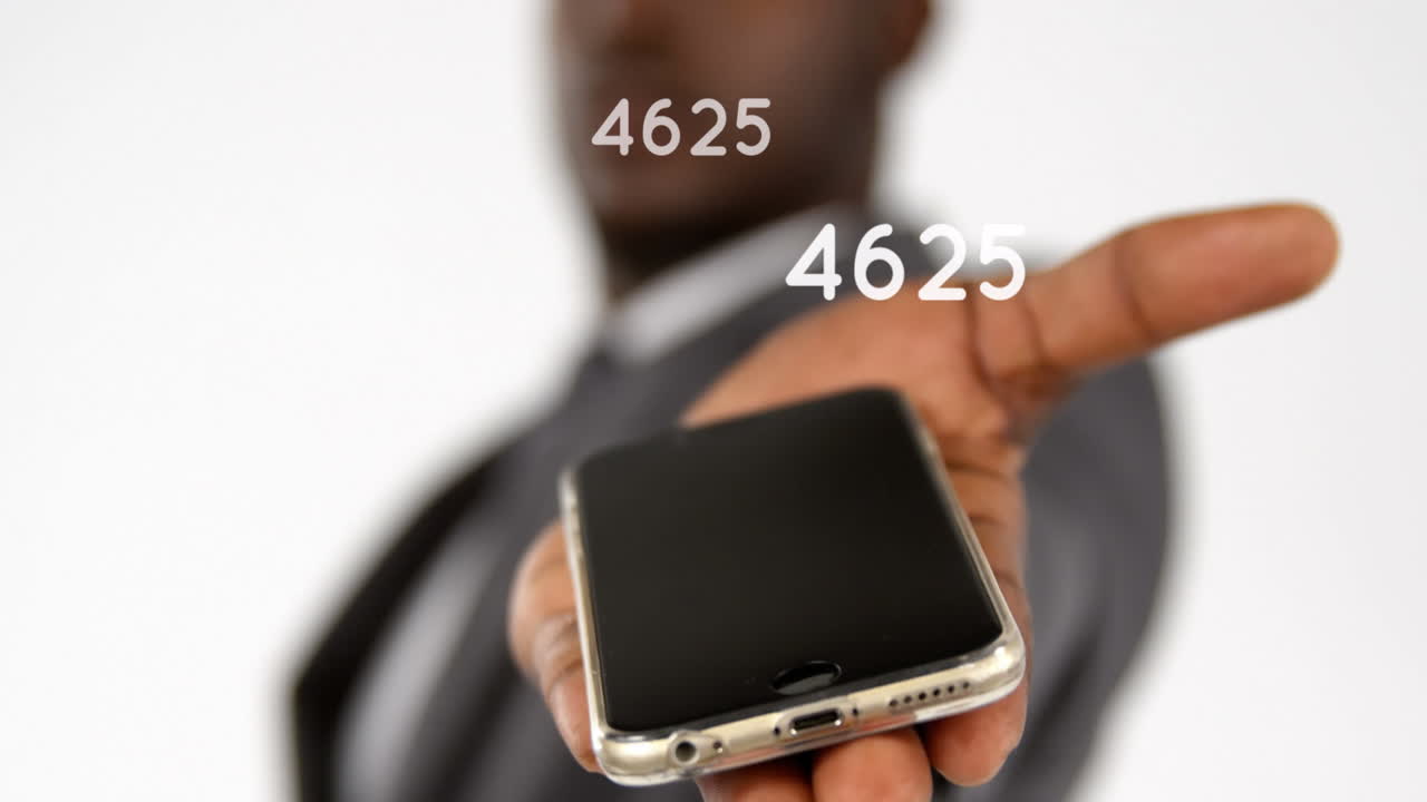 Animation of growing numbers over man holding smartphone