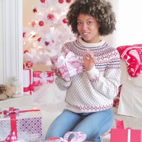 pretty young woman checking her christmas gifts