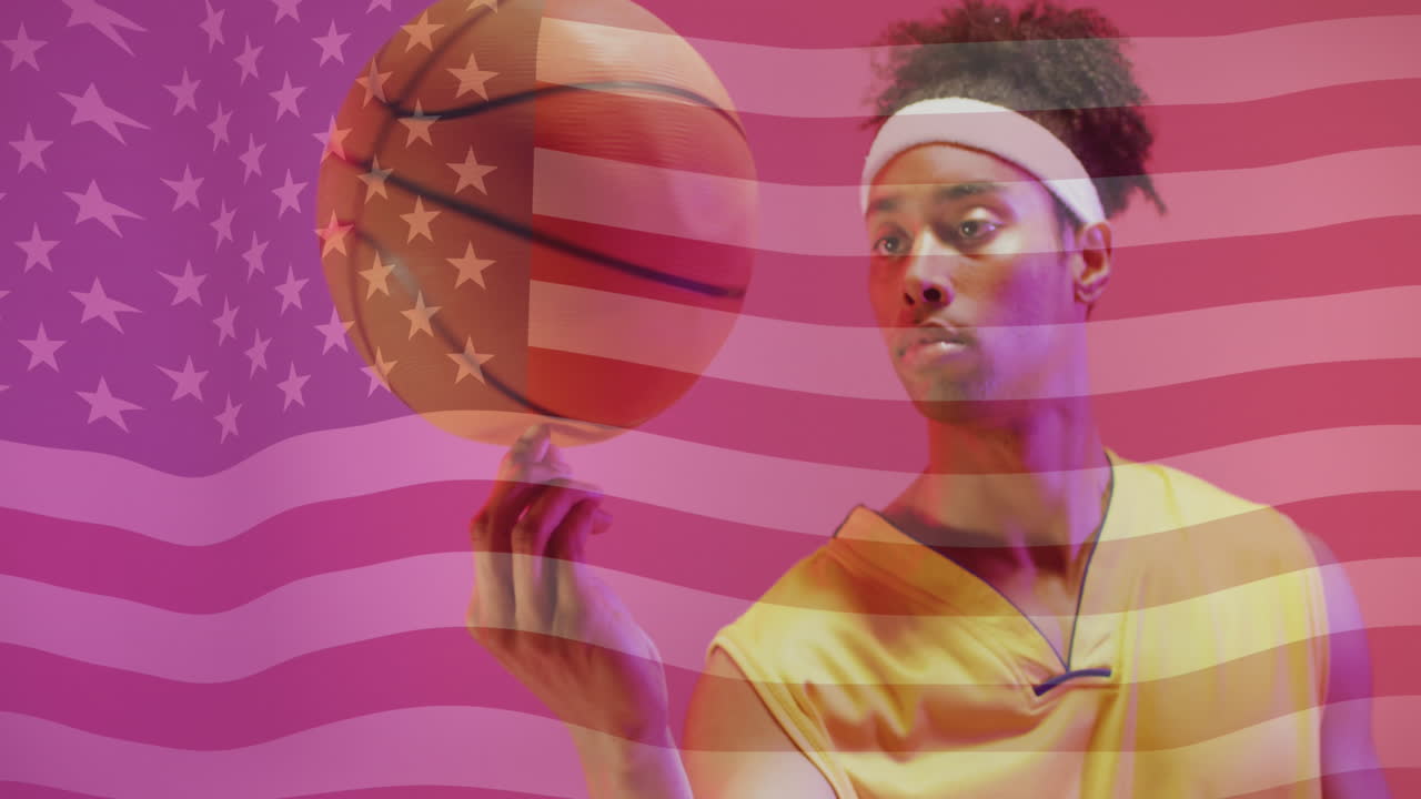 Animação da bandeira americana sobre jogador de basquete masculino afro-americano girando a bola