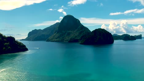 aerial reveal of boats docked in el nido bay, palawan, philippines