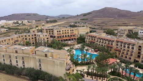 Aerial-view-of-a-hotel-complex-and-its-surroundings-in-the-Maltese-island-of-Gozo