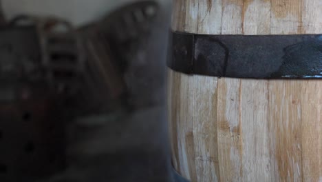 close-up of an old wooden barrel with metal band