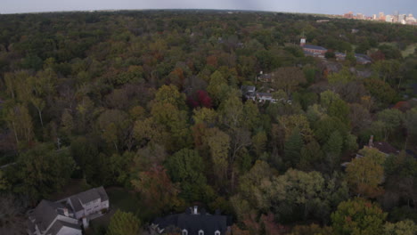 Pull-back-over-suburban-houses-and-trees-in-nice-neighborhood-in-St