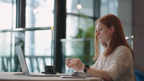 female student is viewing online class sitting at home distant education in foreign high education