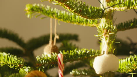 close-up of festive christmas tree with handmade ornaments