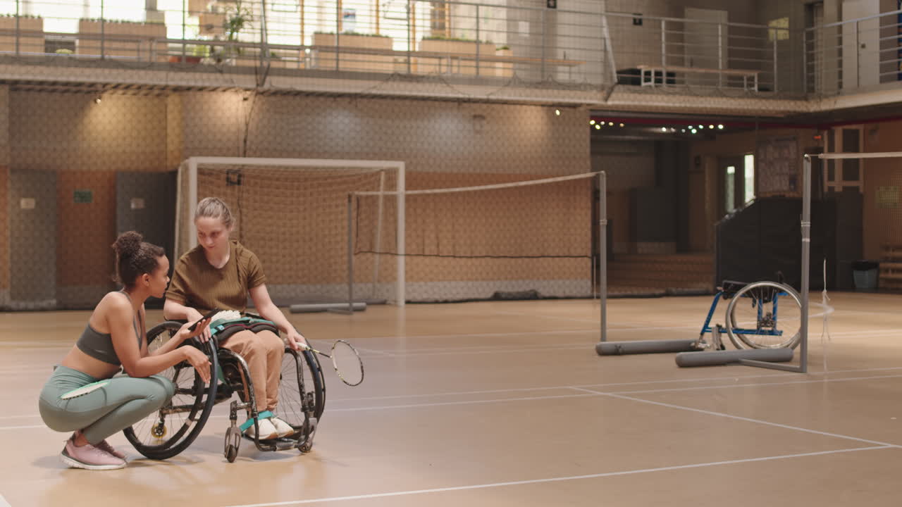 Badminton Player with Disability Talking to Partner