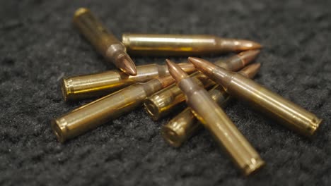 a close up look at a shiny pile of ammunition