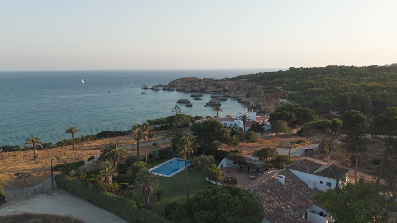 Alvor Portugal seaside cliffs and boats seen from above during calm evening light