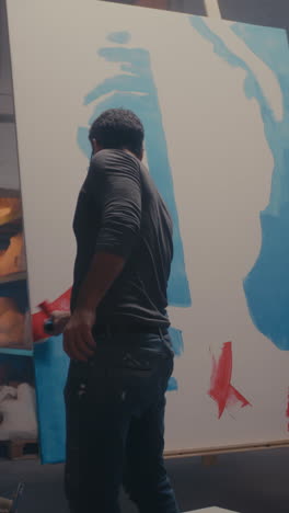 artist painting in a studio