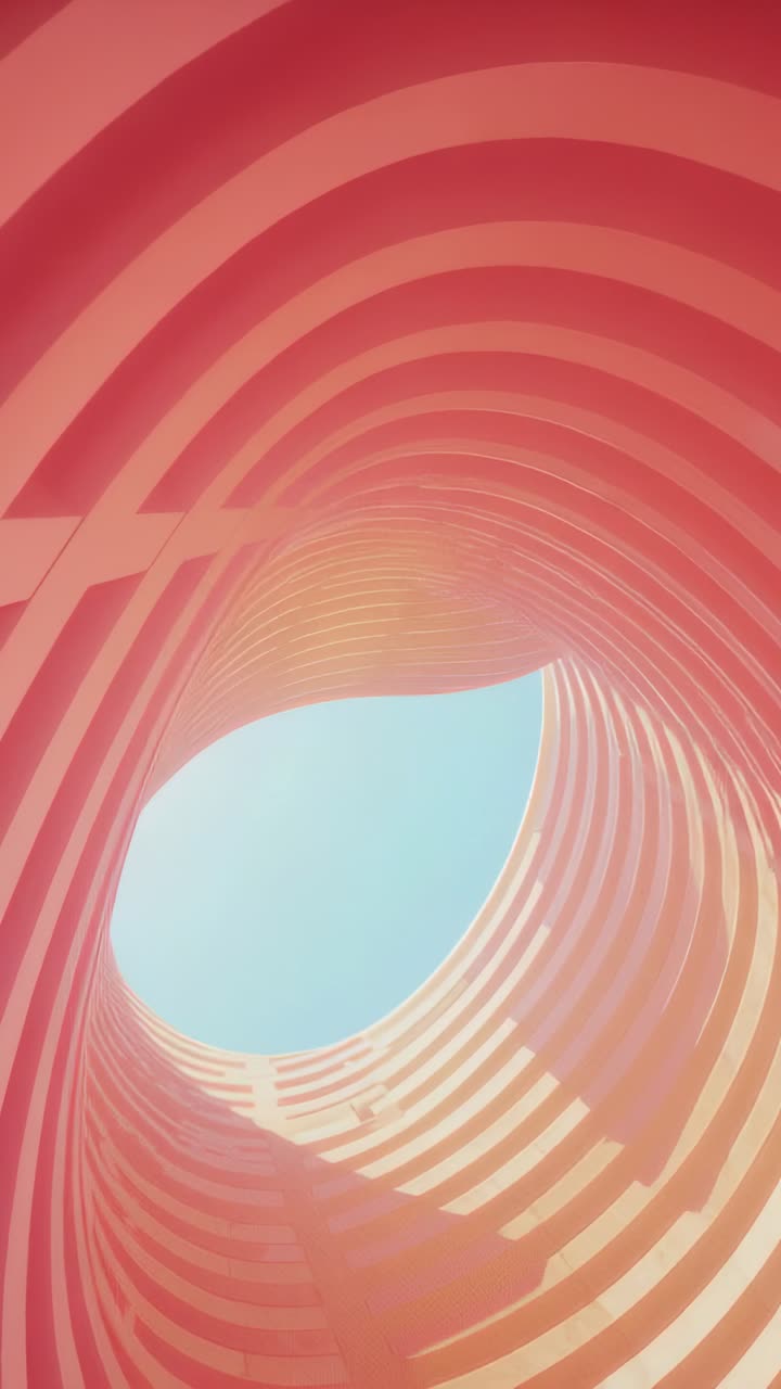 Vertical video: Fixed camera focusing through repeating red tubular ribs, framing pale blue sky